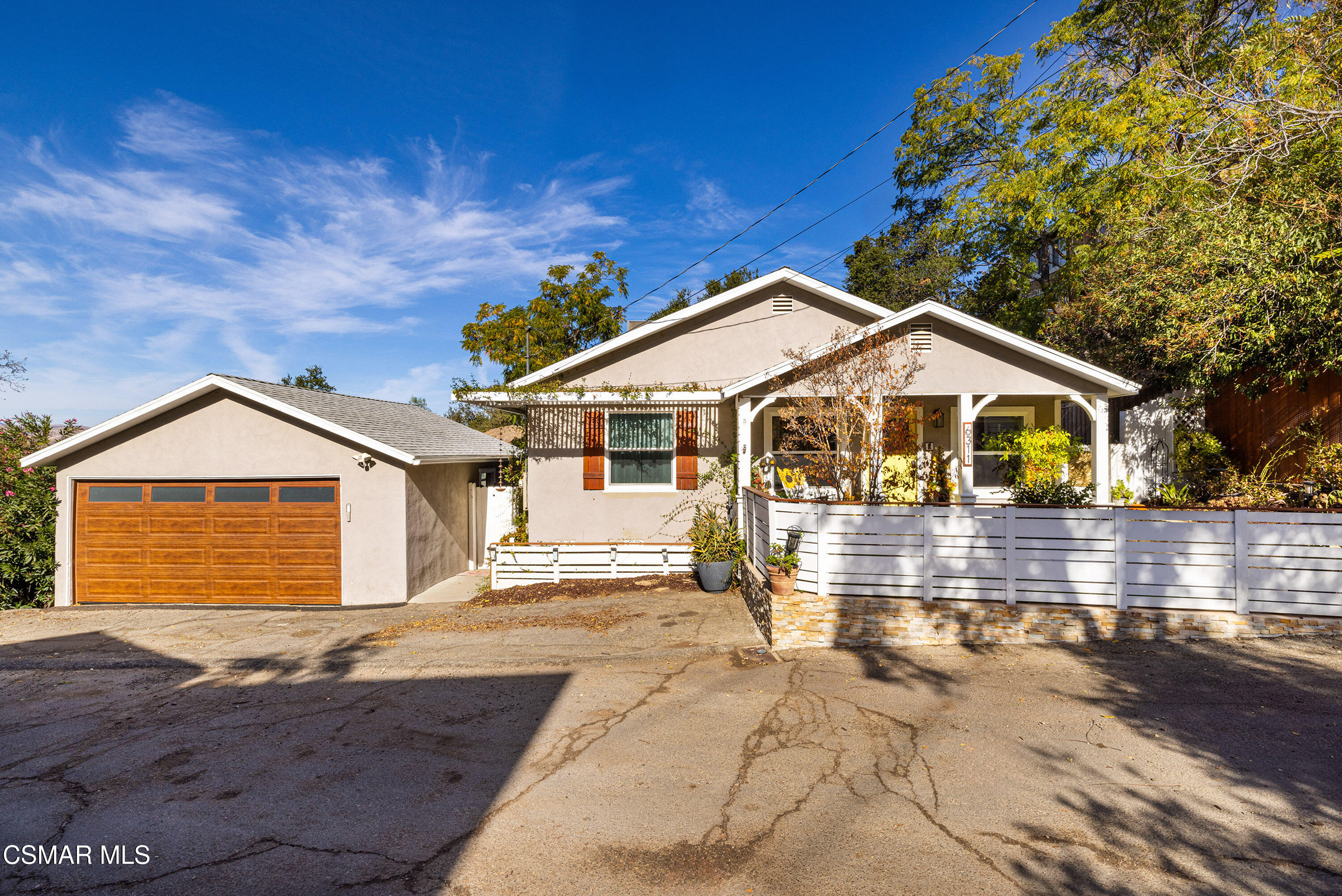 6311 Alta Vista Road Simi Valley, CA 93063 - Photo 1 of 42 a front view of a house with a yard