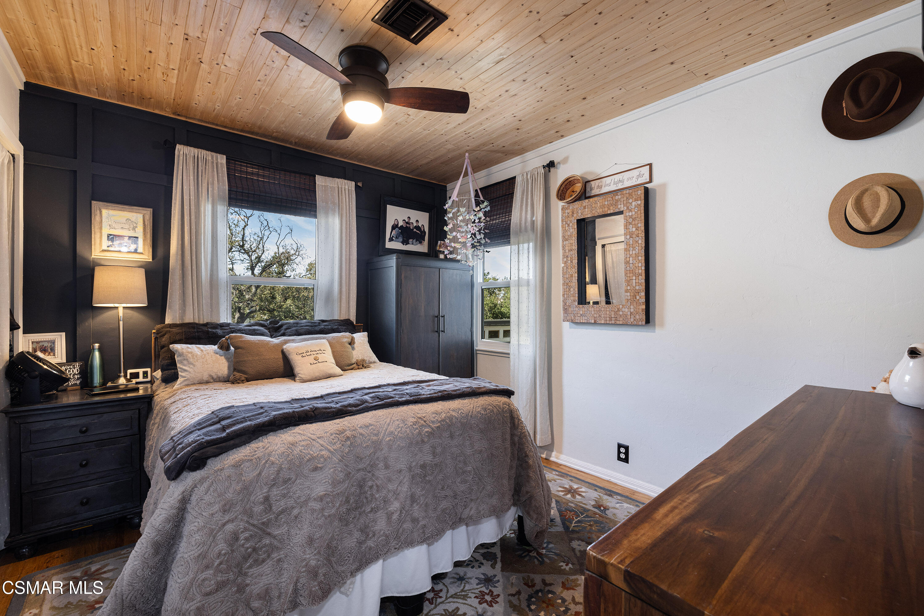 6311 Alta Vista Road Simi Valley, CA 93063 - Photo 16 of 42 a bed room with a bed and a chandelier