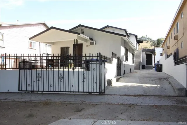 a front view of a house with garage