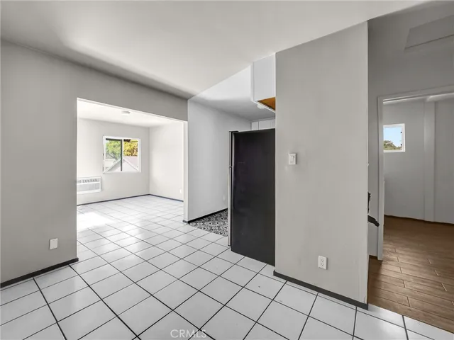 a view of an empty room and closet area