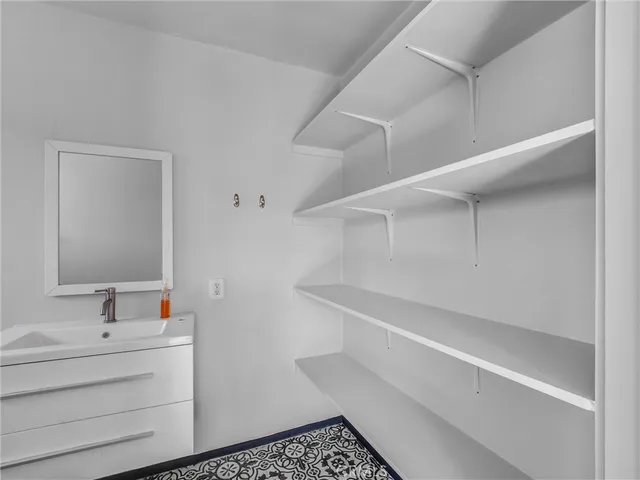 a bathroom with a bathtub and a sink