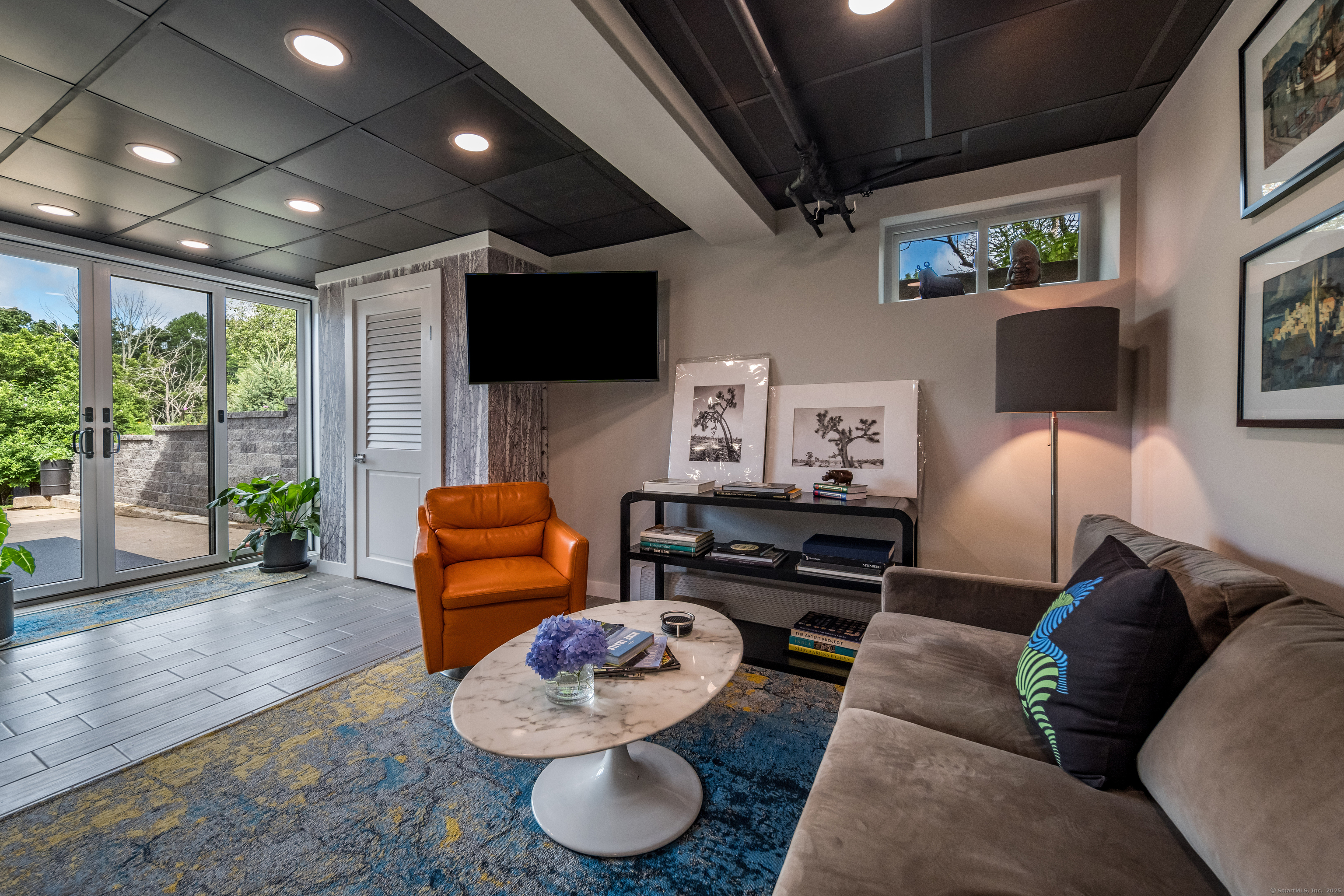 55 Bogel Road East Haddam, CT 06423 - Photo 23 of 39 a living room with furniture and a flat screen tv