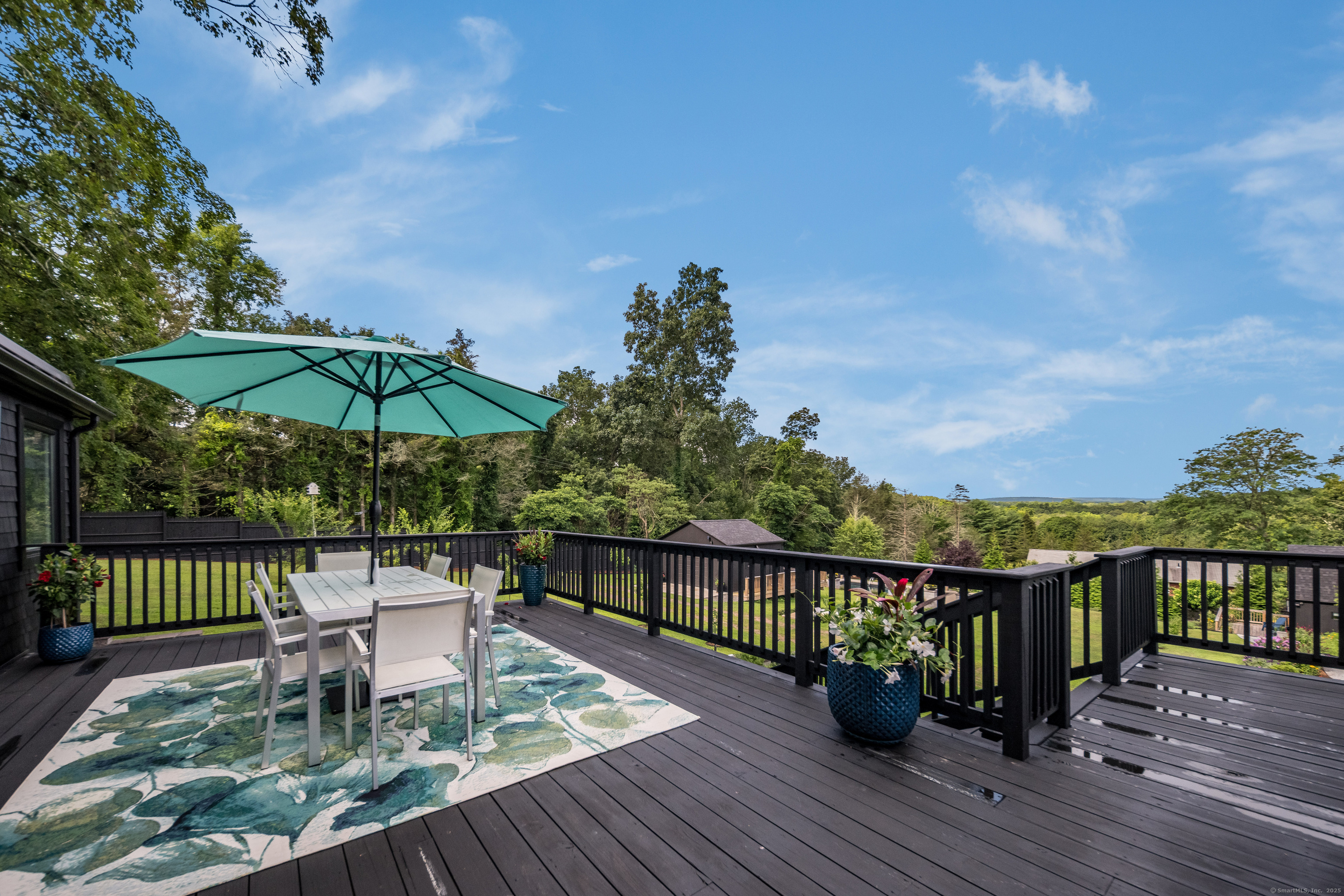 55 Bogel Road East Haddam, CT 06423 - Photo 24 of 39 a view of a balcony with wooden floor and outdoor seating