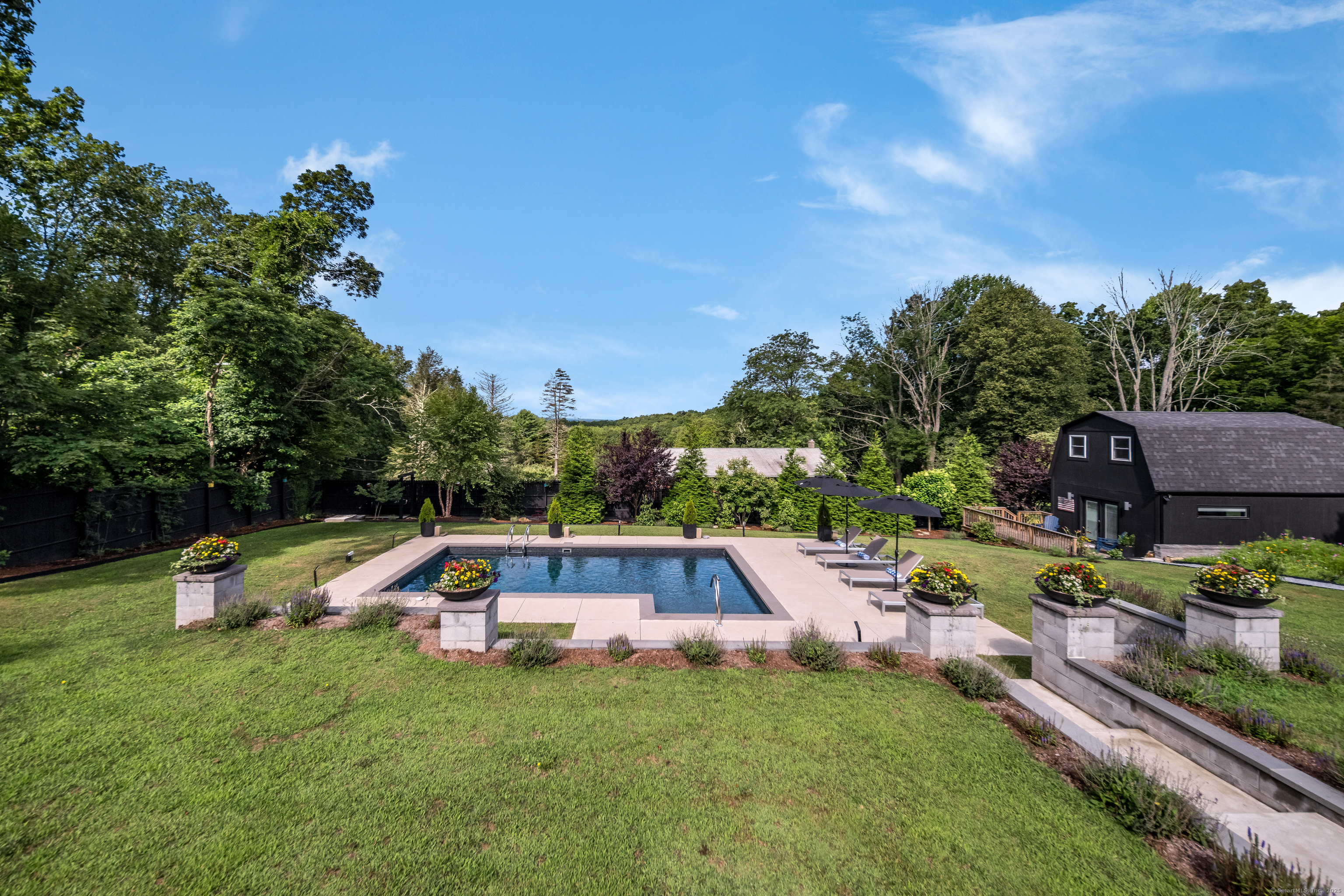 55 Bogel Road East Haddam, CT 06423 - Photo 33 of 39 a backyard of a house with table and chairs
