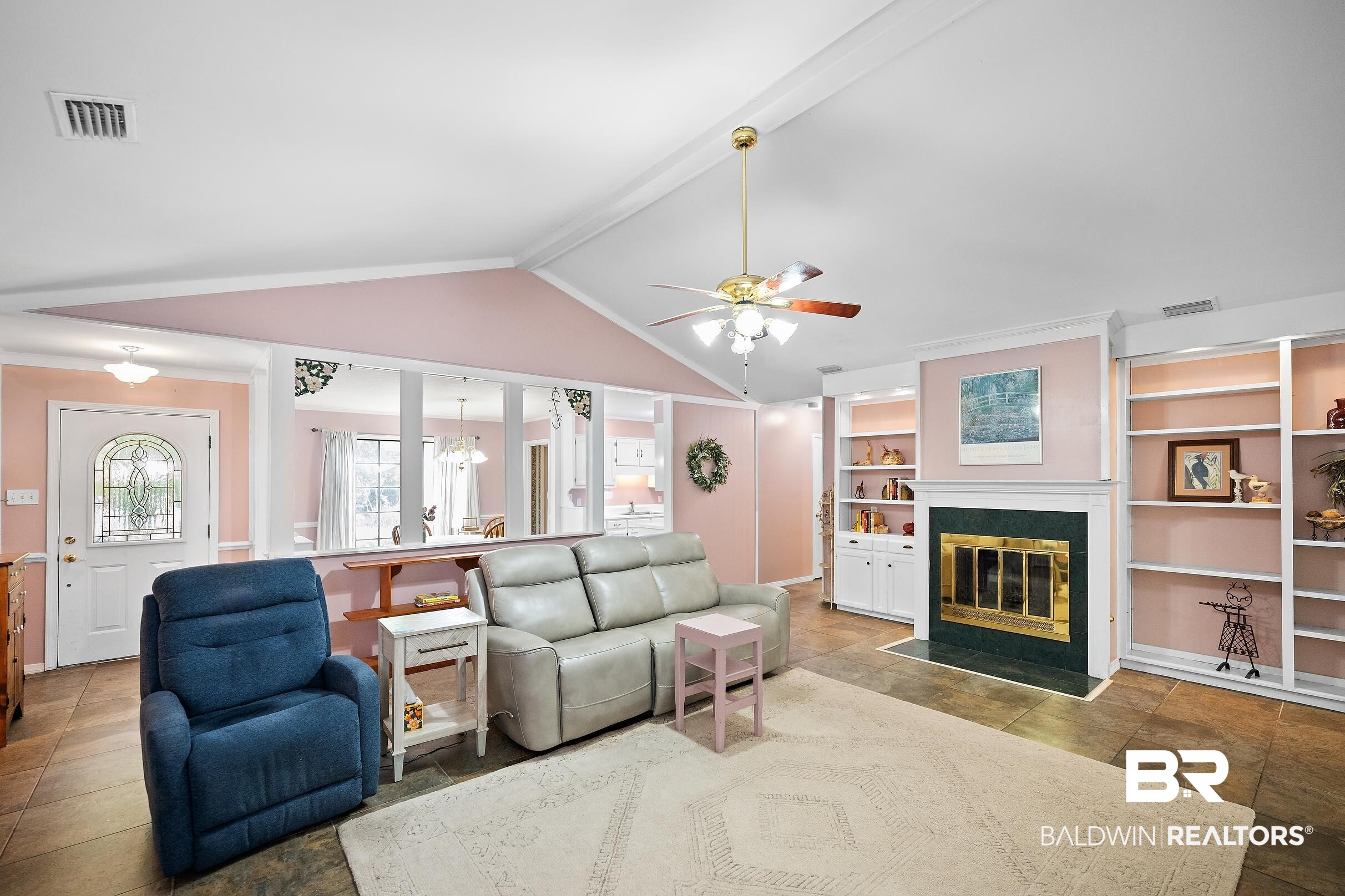 4026 Kingsrow Row Mobile, AL 36619 - Photo 8 of 51 Living area with a ceiling fan, built in shelves, beam ceiling, a fireplace with flush hearth, and hanging lights