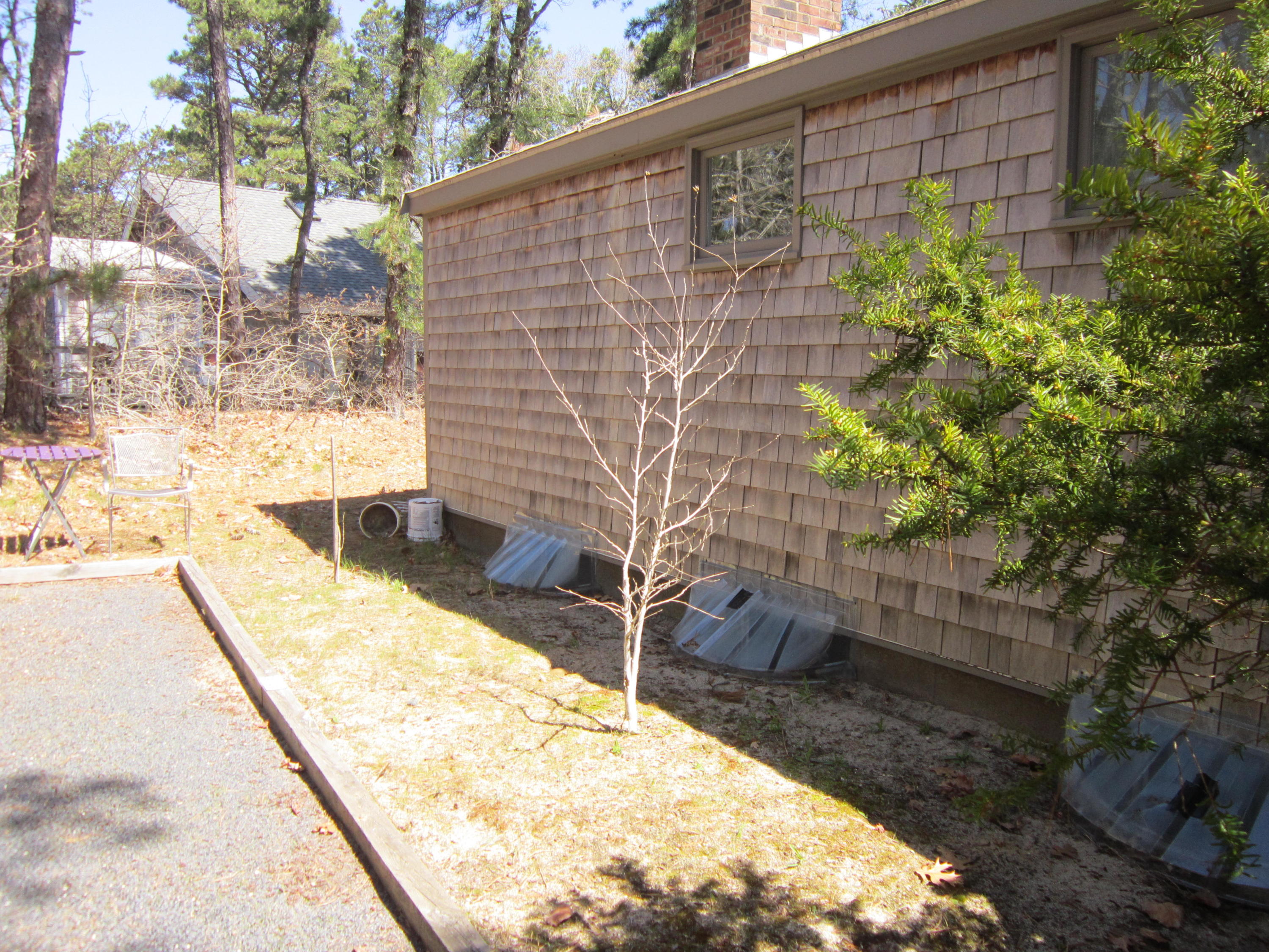 27 Bartlett Road Wellfleet, MA 02667 - Photo 6 of 32 a backyard of a house with outdoor seating