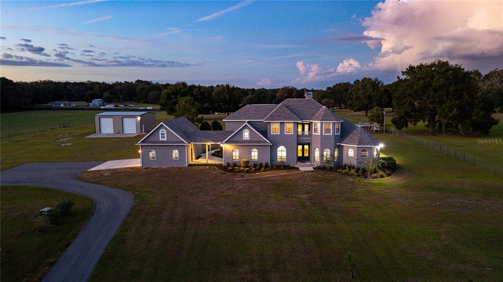 16222 Nolan Road Dade City, FL 33523 - Photo 1 of 1 an aerial view of a house with a garden