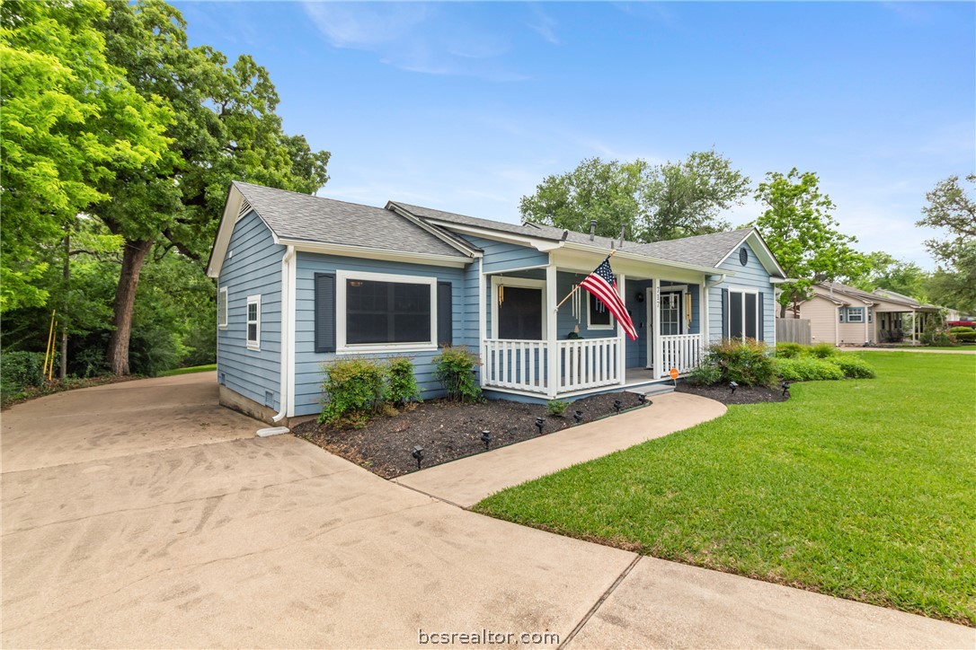 717 Inwood Drive Bryan, TX 77802 - Photo 14 of 48 Covered front porch and entry with polywood type decking.