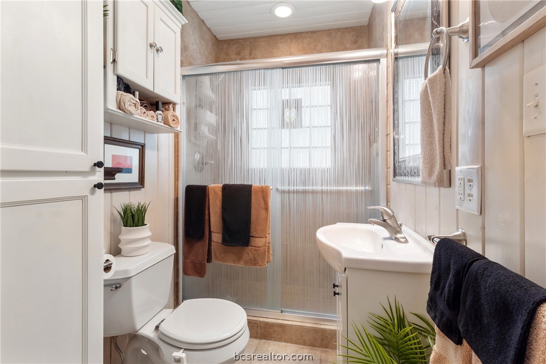 717 Inwood Drive Bryan, TX 77802 - Photo 27 of 48 One of two baths, this one next to the Primary bed is step in shower only.