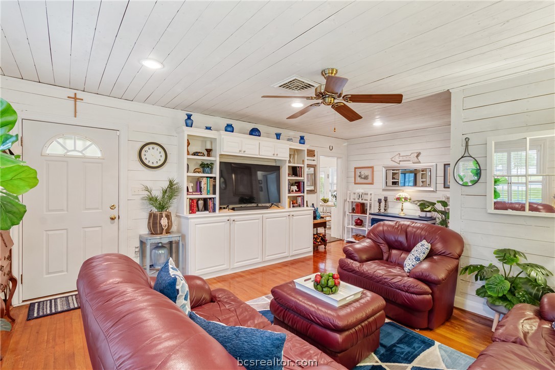 717 Inwood Drive Bryan, TX 77802 - Photo 8 of 48 Front door entry is covered and welcomes guest into the family room with shiplap ceilings.