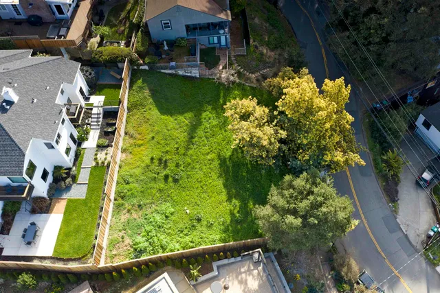 an aerial view of house with yard swimming pool and outdoor seating