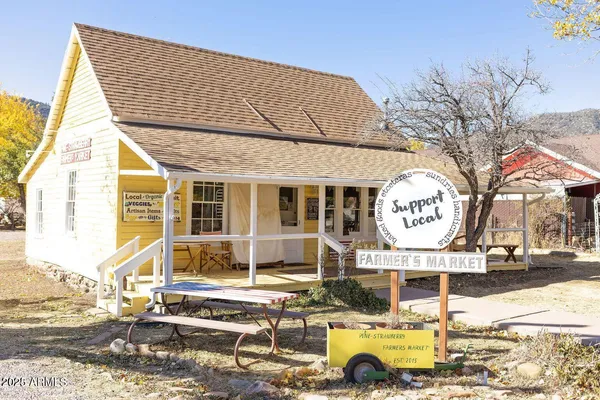a front view of house with outdoor seating