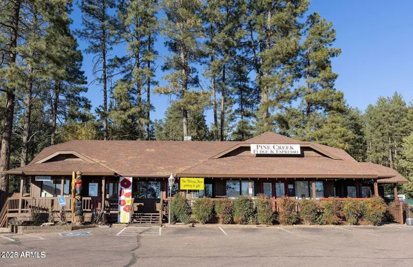 a front view of a house with parking space