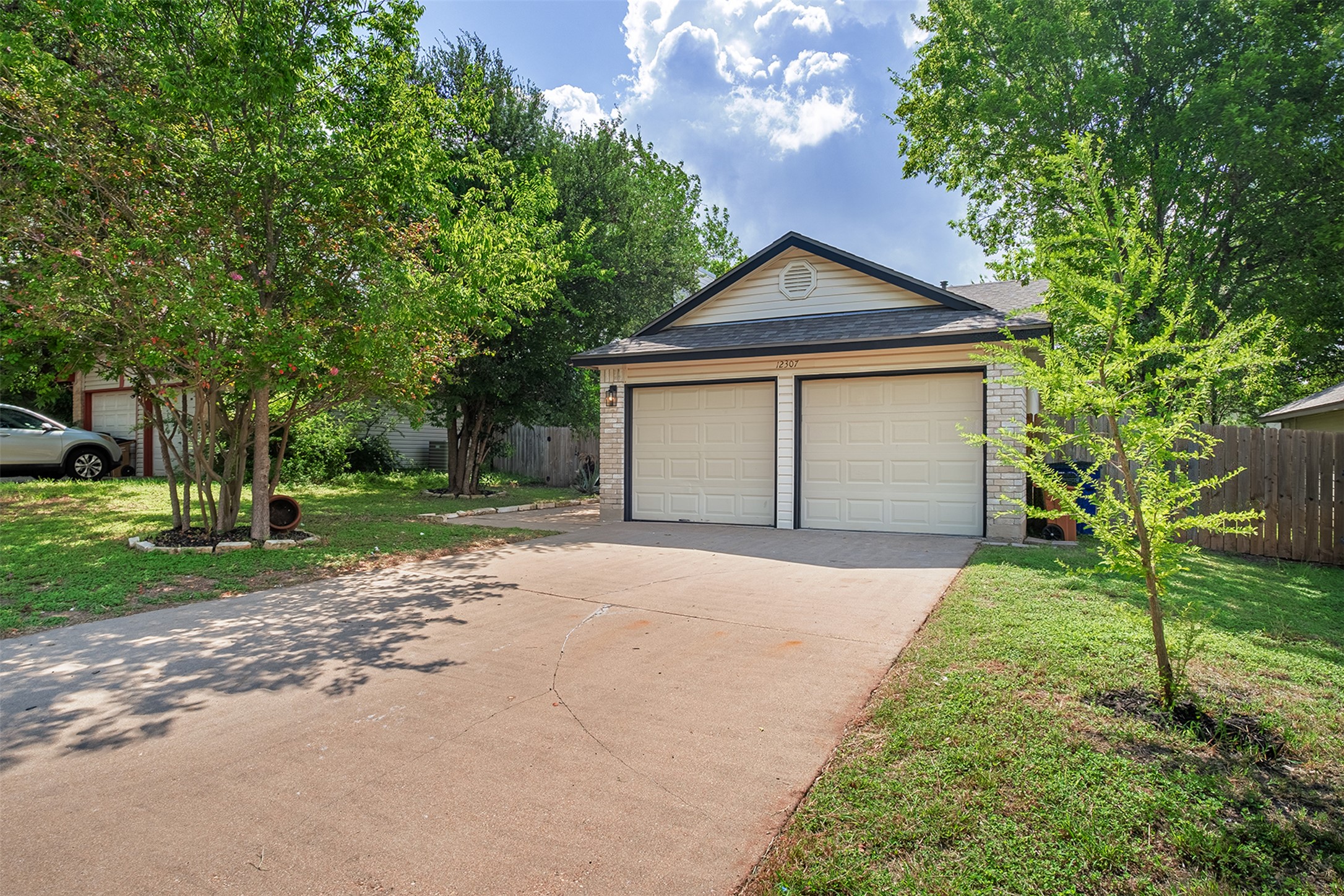 12307 Marogot Run Austin, TX 78758 - Photo 1 of 1 a front view of house with yard and green space