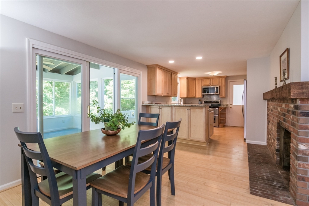 45 Cave Hill Road Leverett, MA 01054 - Photo 11 of 42 a dining room with furniture and a kitchen view