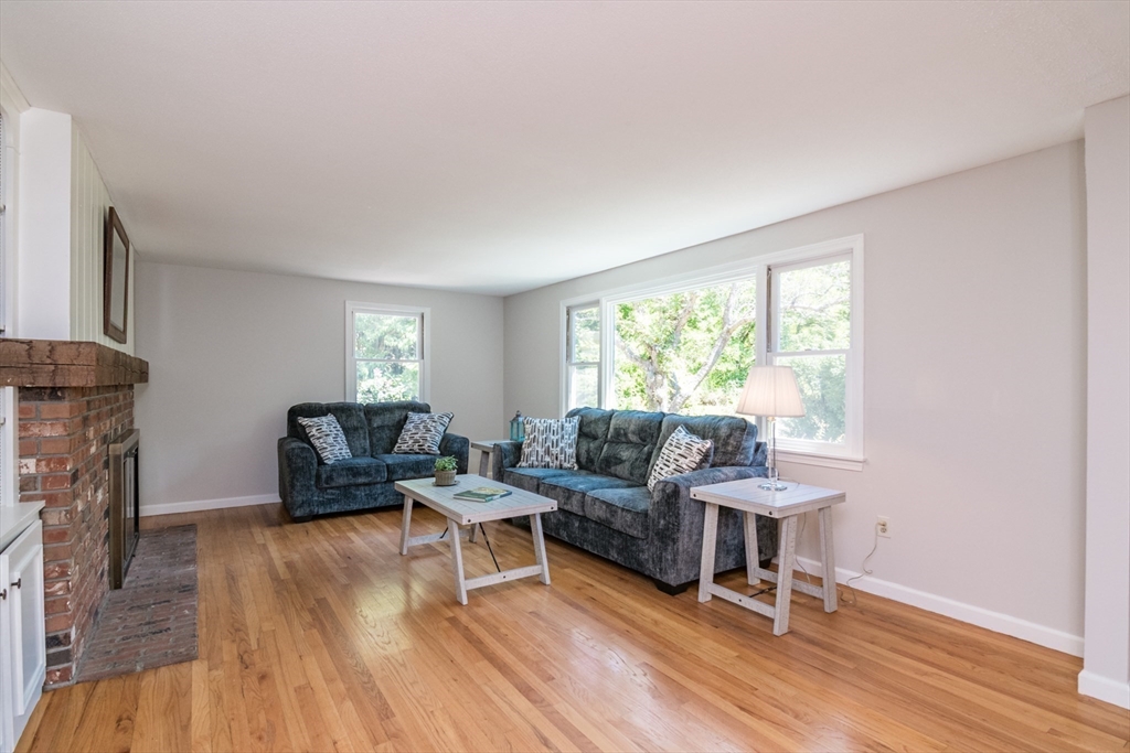 45 Cave Hill Road Leverett, MA 01054 - Photo 17 of 42 a living room with furniture and a fireplace