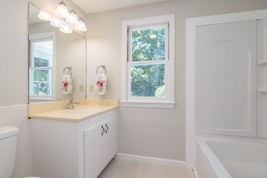 45 Cave Hill Road Leverett, MA 01054 - Photo 23 of 42 a bathroom with a sink a mirror and a bathtub