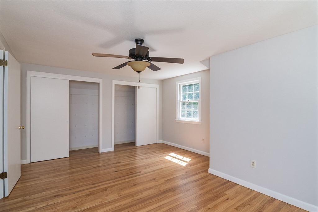 45 Cave Hill Road Leverett, MA 01054 - Photo 25 of 42 a view of an empty room with wooden floor and a window