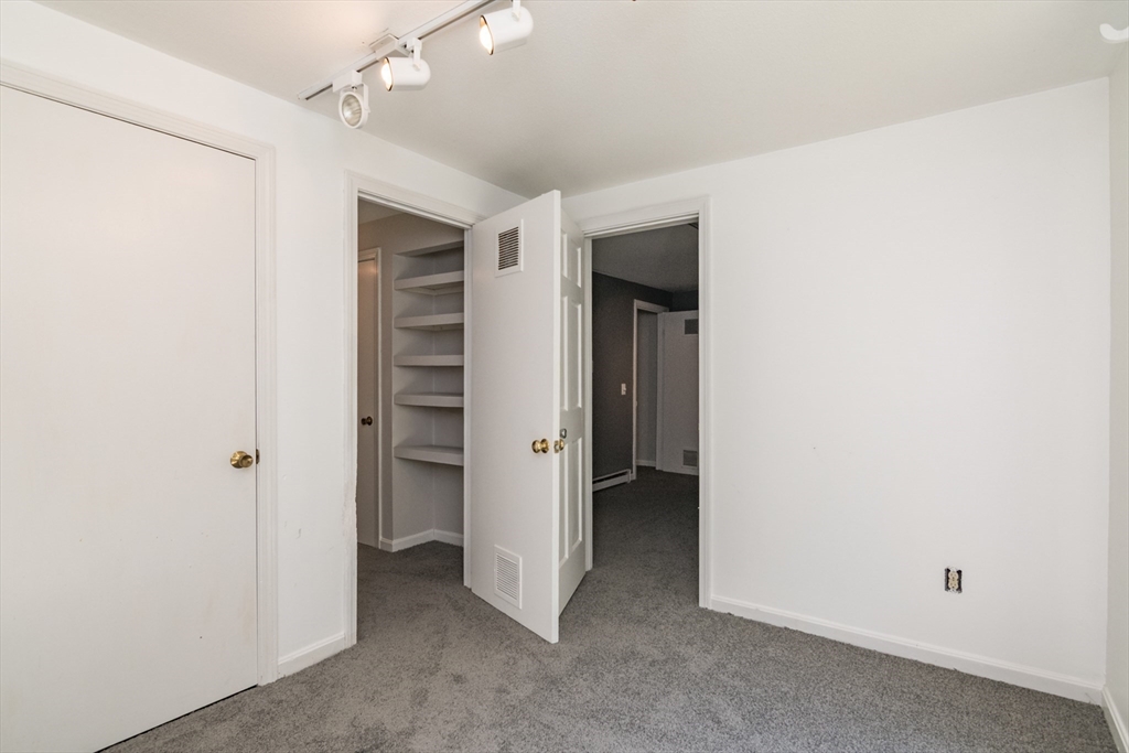 45 Cave Hill Road Leverett, MA 01054 - Photo 34 of 42 a view of an empty room with closet and a window