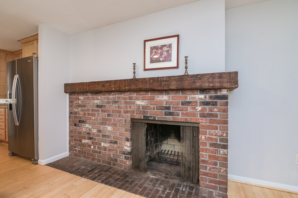45 Cave Hill Road Leverett, MA 01054 - Photo 9 of 42 a stone fireplace with a hallway