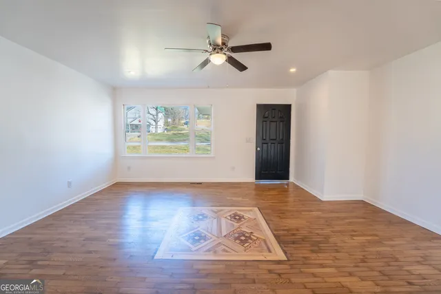 a kitchen with stainless steel appliances a refrigerator and a stove top oven