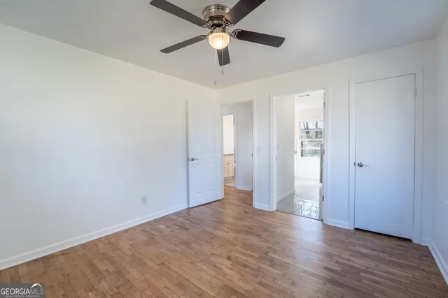 a bathroom with double vanity sinks and a mirror