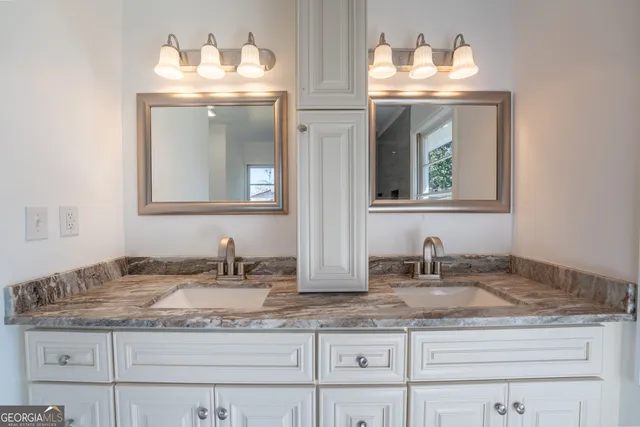 a view of a big room with wooden floor and windows