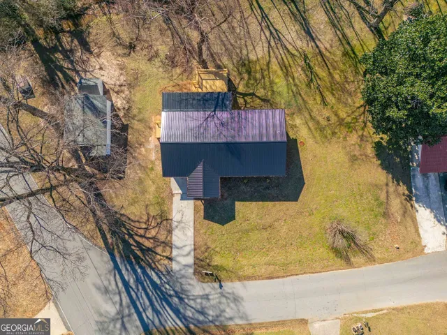 an aerial view of residential house and green space