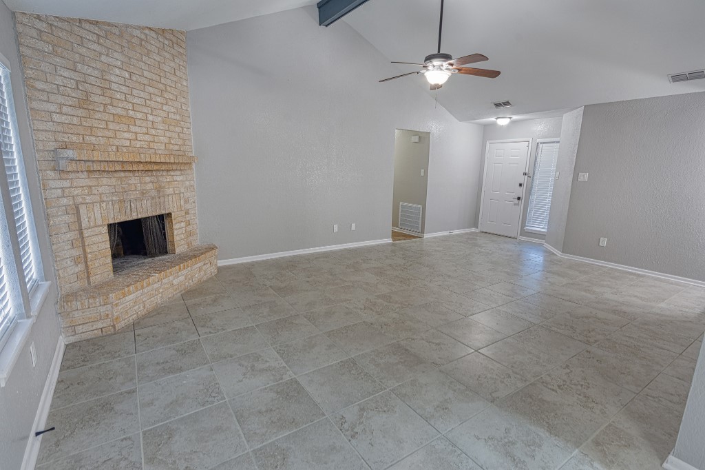 7017 Keystone Drive Corpus Christi, TX 78413 - Photo 12 of 21 a view of an empty room with a fireplace