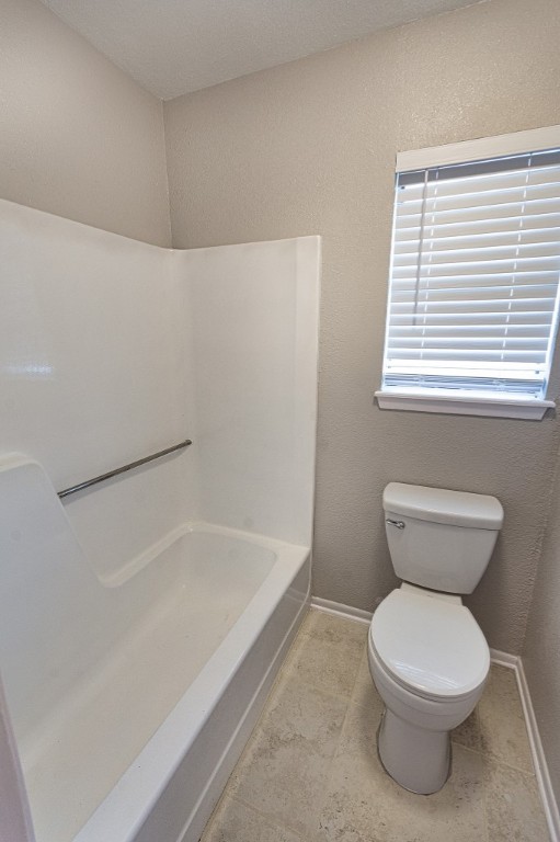 7017 Keystone Drive Corpus Christi, TX 78413 - Photo 14 of 21 a white toilet sitting next to a bath tub