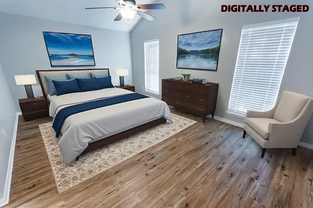 a bedroom with bed and wooden floor