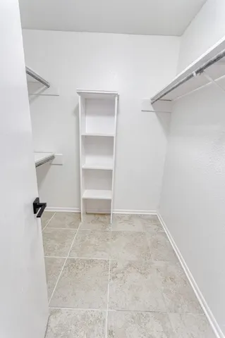 a view of an empty walk in closet