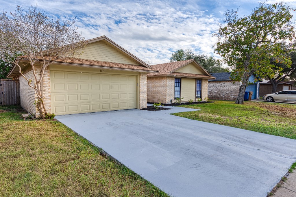 7017 Keystone Drive Corpus Christi, TX 78413 - Photo 2 of 21 front view of a house with a yard