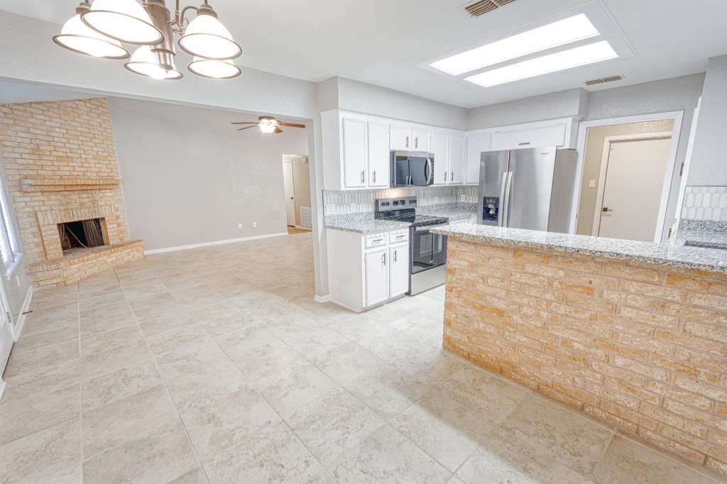 7017 Keystone Drive Corpus Christi, TX 78413 - Photo 5 of 21 a view of a kitchen with a stove cabinets and a kitchen view