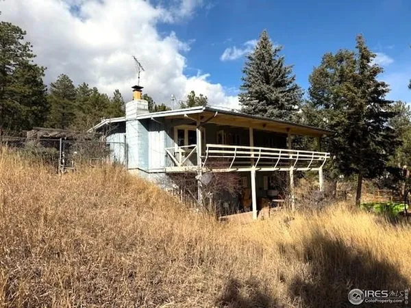 a view of house with yard