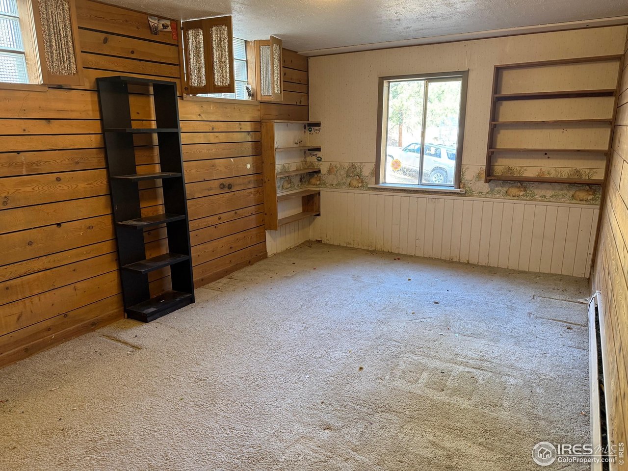 358 Kelly Road East Boulder, CO 80302 - Photo 11 of 16 a view of an empty room with a window