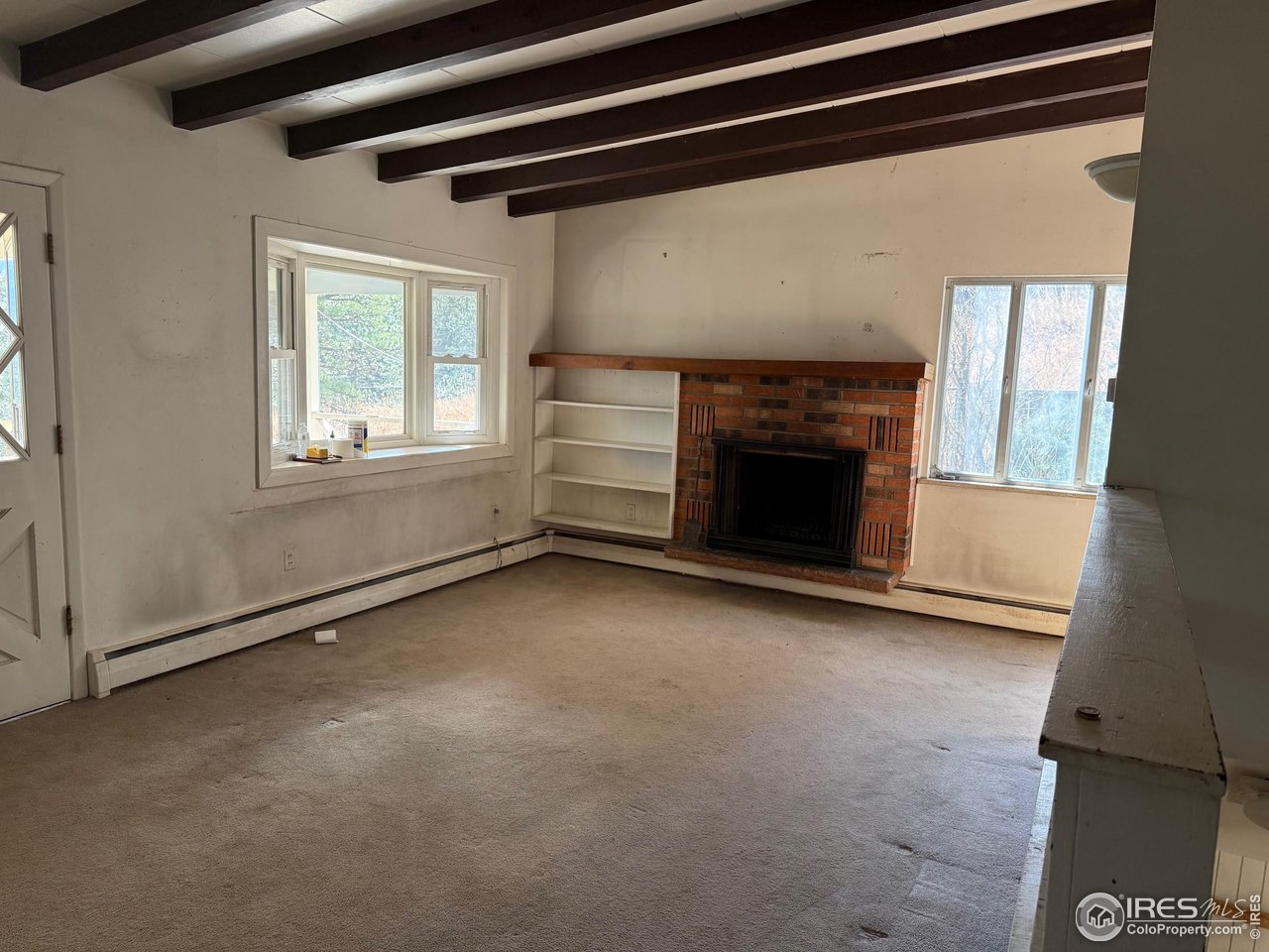 358 Kelly Road East Boulder, CO 80302 - Photo 4 of 16 a view of empty room with fireplace