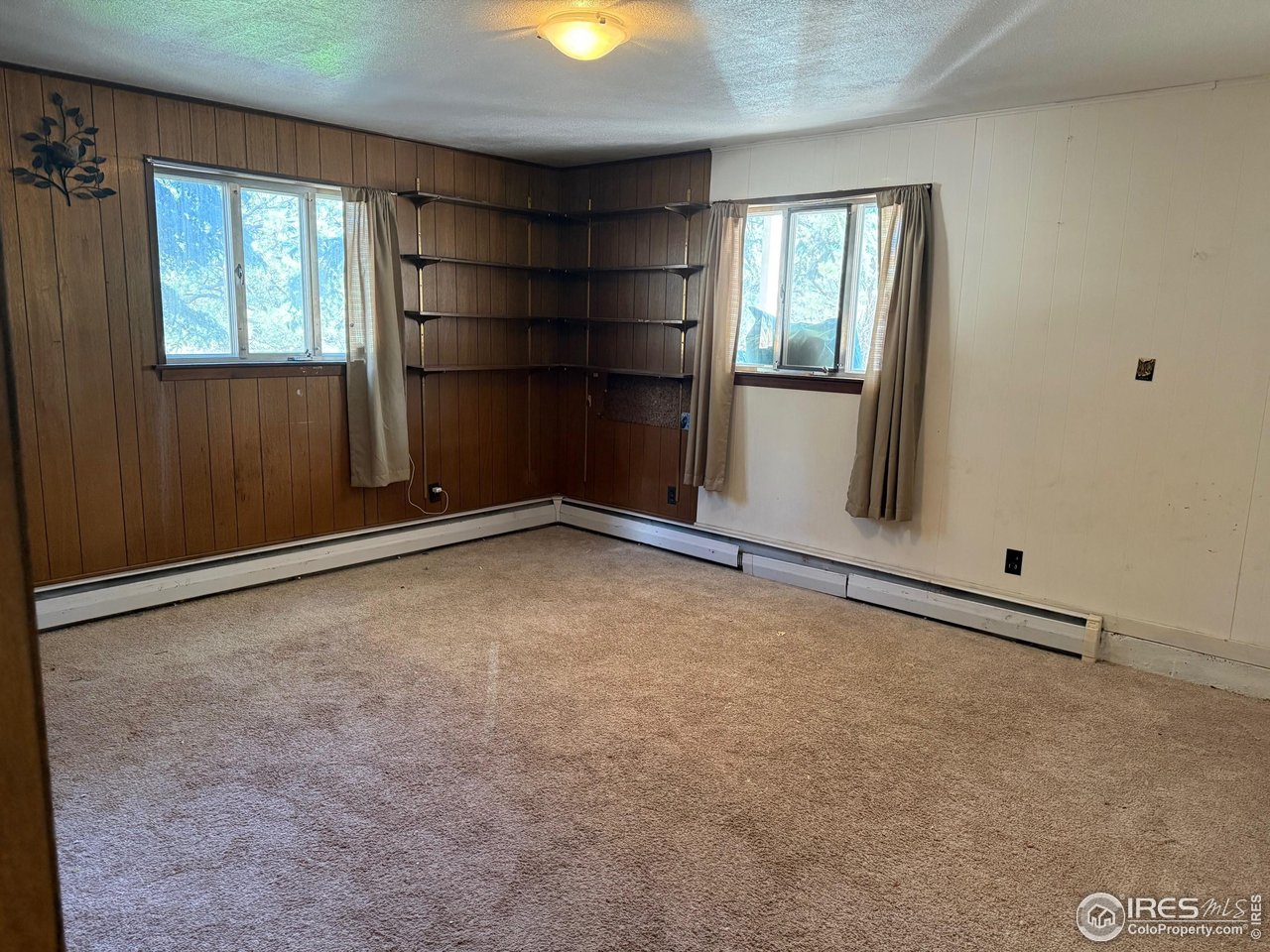 358 Kelly Road East Boulder, CO 80302 - Photo 9 of 16 an empty room with windows