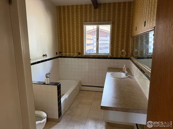 a view of walk in closet with window