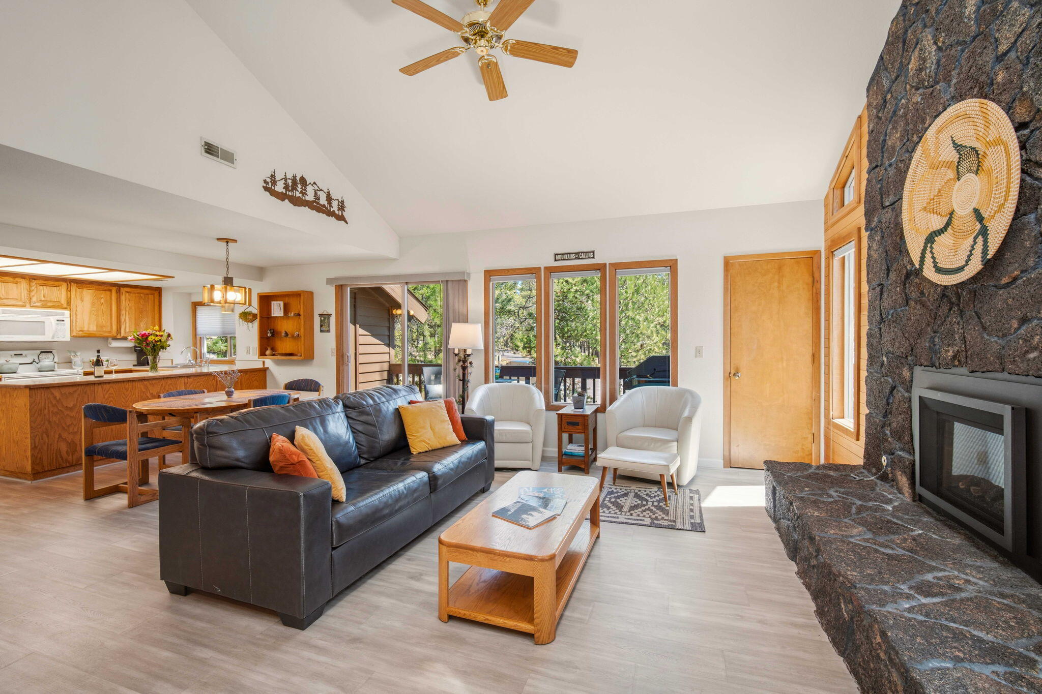 57305 Beaver Ridge Loop, Unit 8 Sunriver, OR 97707 - Photo 4 of 25 a living room with furniture and a fireplace