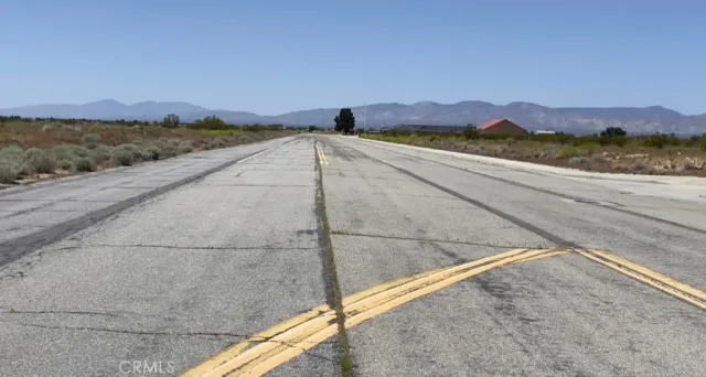 a picture of a wall with a white building