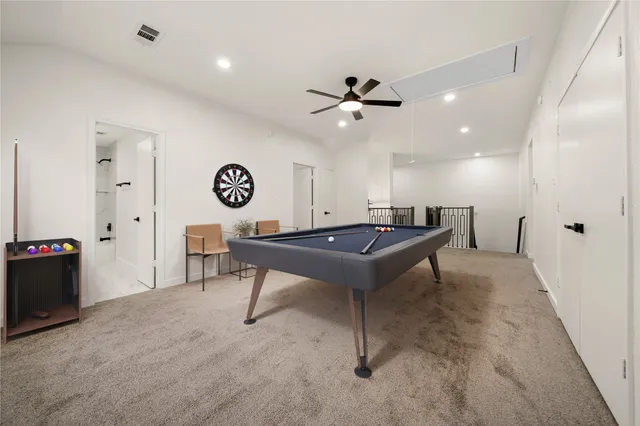 a bedroom with furniture and a large window