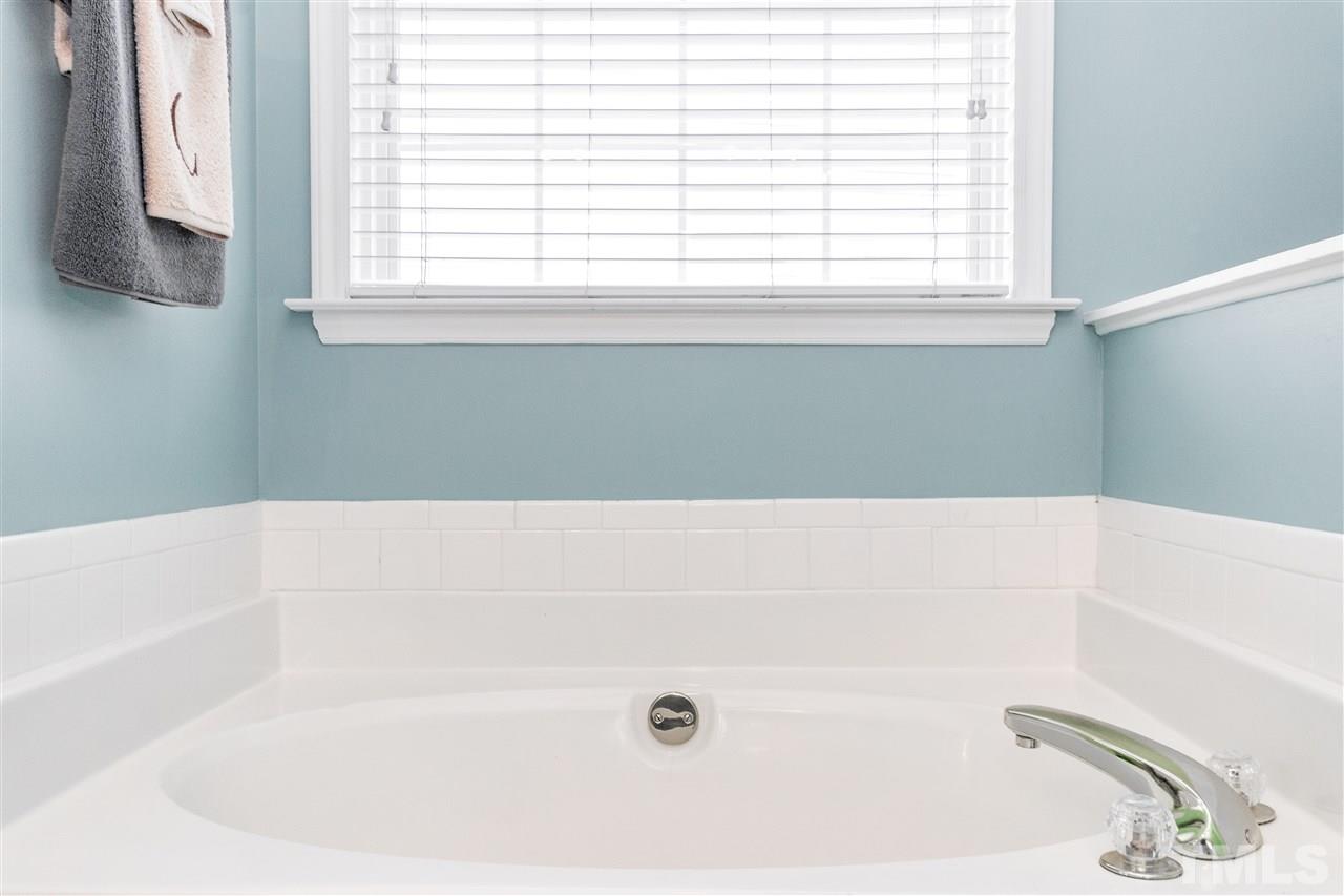 1913 Crag Burn Lane Raleigh, NC 27604 - Photo 16 of 29 a bathroom with a bathtub