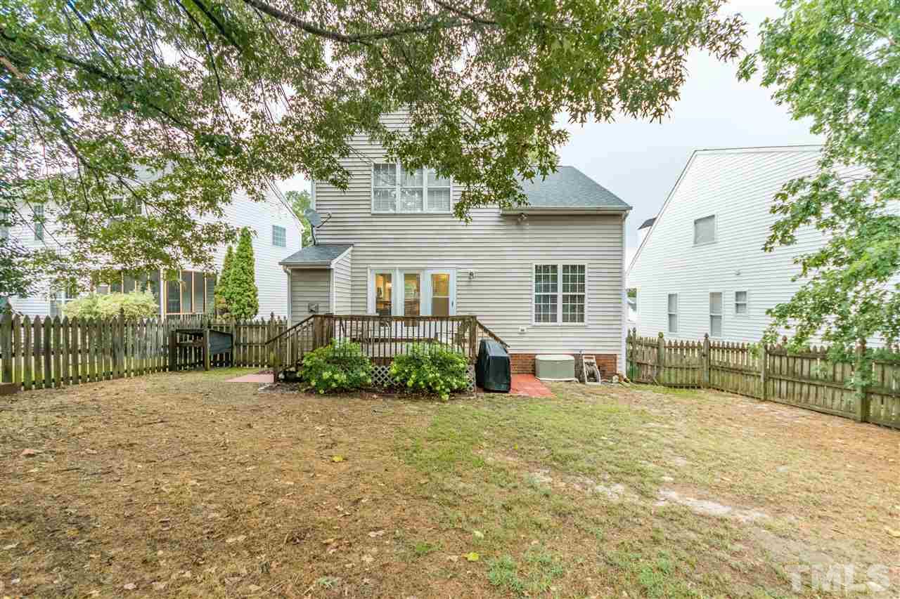 1913 Crag Burn Lane Raleigh, NC 27604 - Photo 3 of 29 a view of a house with a big yard and large tree