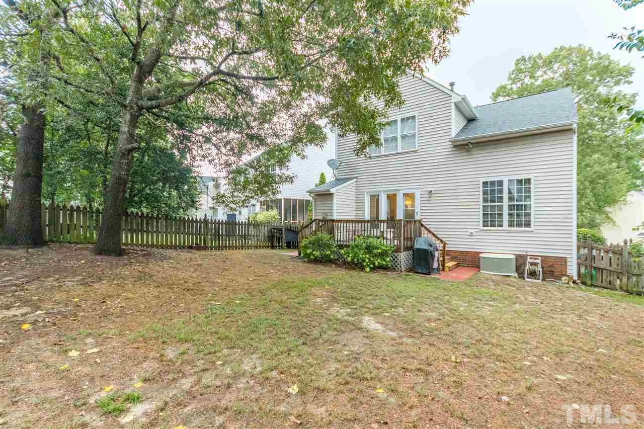 1913 Crag Burn Lane Raleigh, NC 27604 - Photo 28 of 29 a view of a house with backyard and trees