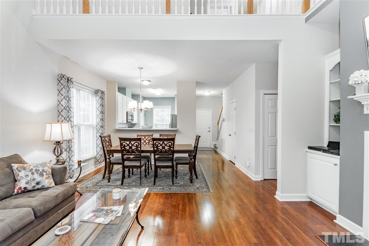 1913 Crag Burn Lane Raleigh, NC 27604 - Photo 5 of 29 a view of a dining room with furniture and wooden floor