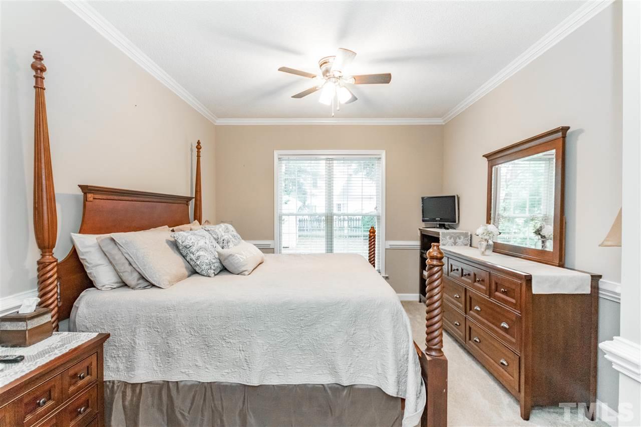 1913 Crag Burn Lane Raleigh, NC 27604 - Photo 6 of 29 a bedroom with a large bed and a window