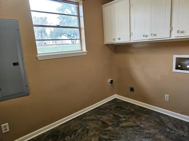 an empty room with cabinet