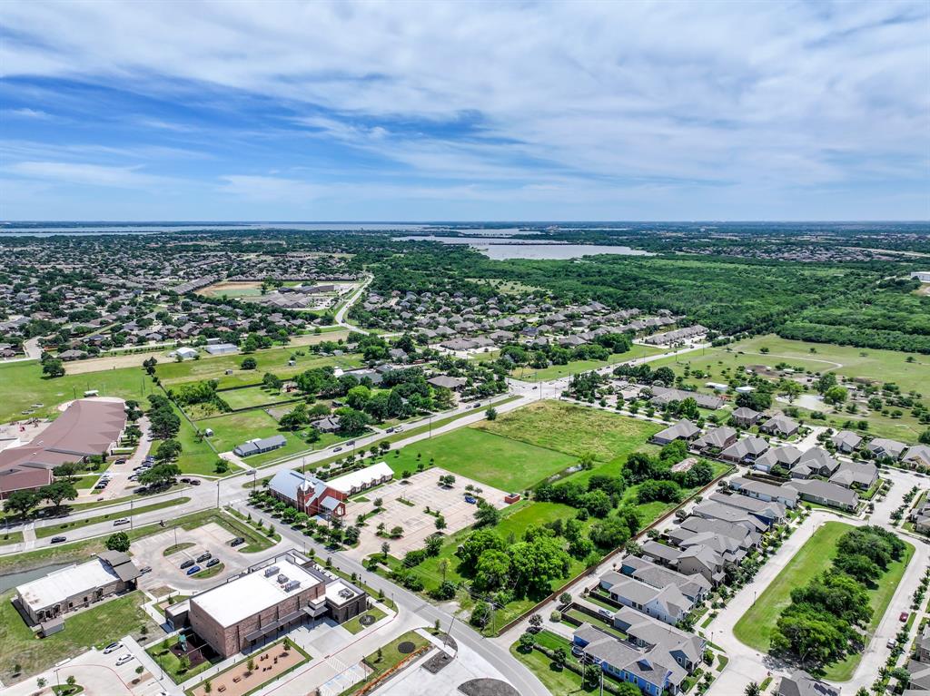 8701 Liberty Grove Road Rowlett, TX 75089 - Photo 6 of 18 an aerial view of residential houses with outdoor space