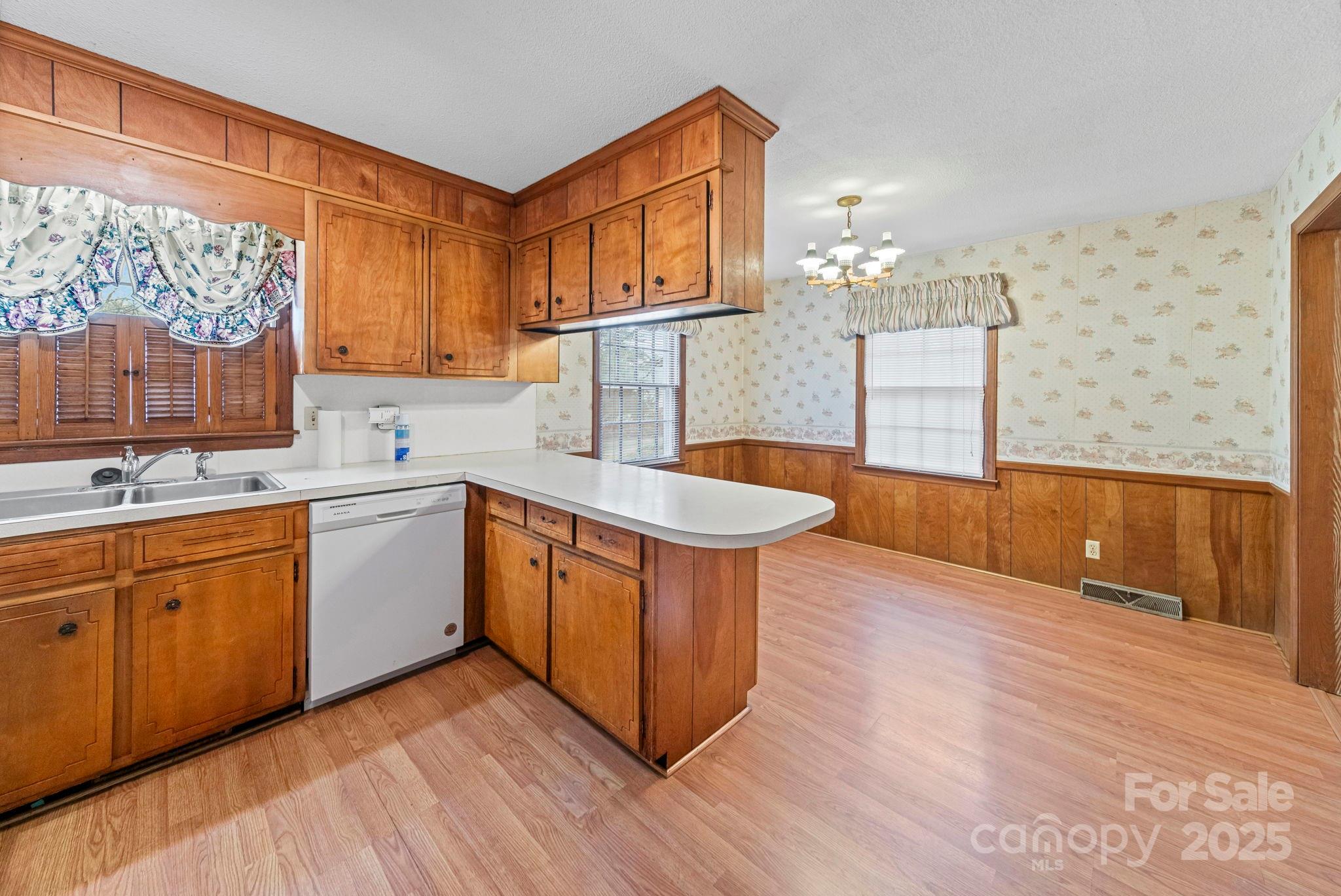 1902 Shady Lane Monroe, NC 28110 - Photo 13 of 36 a kitchen with stainless steel appliances granite countertop a sink a stove a refrigerator and cabinets